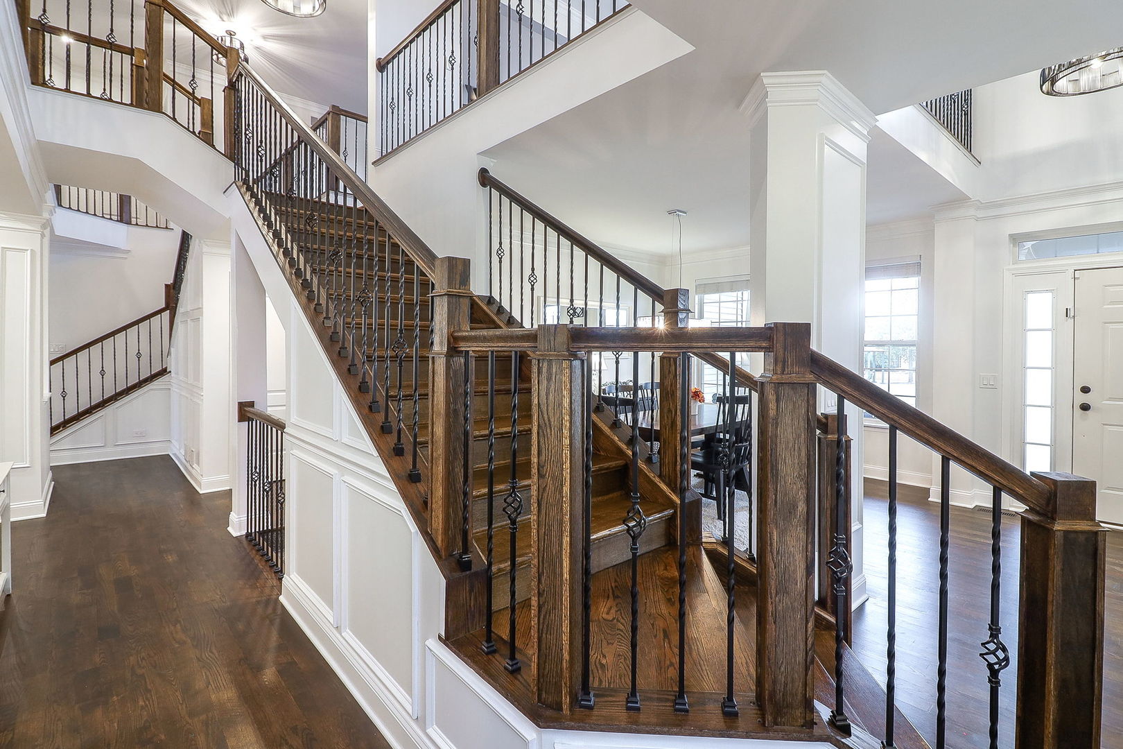 335 Forest Trail South Elgin, IL 60177 - Photo 6 of 47 a view of staircase with lots of frames on wall and wooden floor