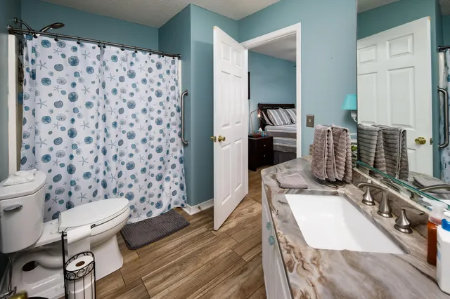 a living room with furniture and a rug