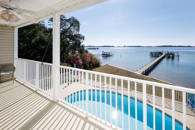 a view of a swimming pool with an outdoor seating
