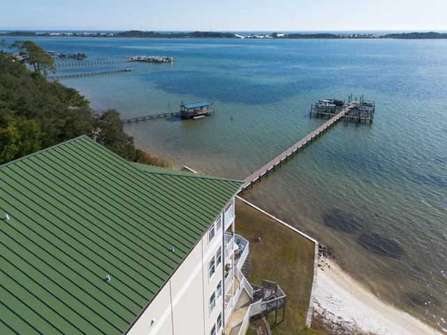 a view of a lake with outdoor seating