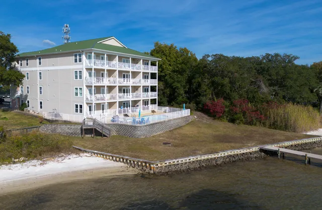 an aerial view of a house with a ocean view