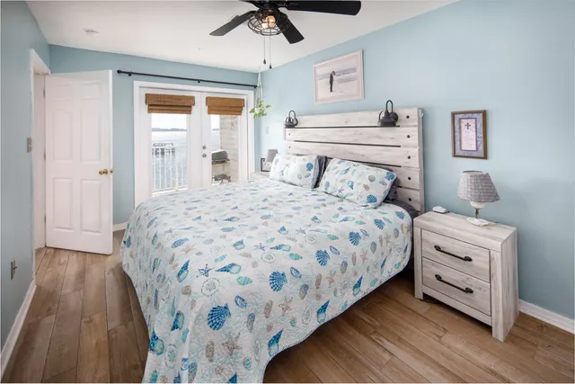 a bedroom with a bed and a dresser