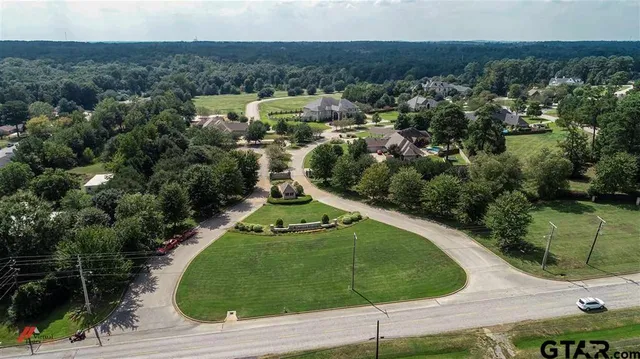 an aerial view of a house with a garden