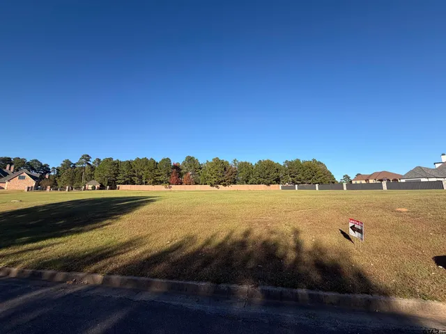 a view of a swimming pool with an outdoor space and seating area