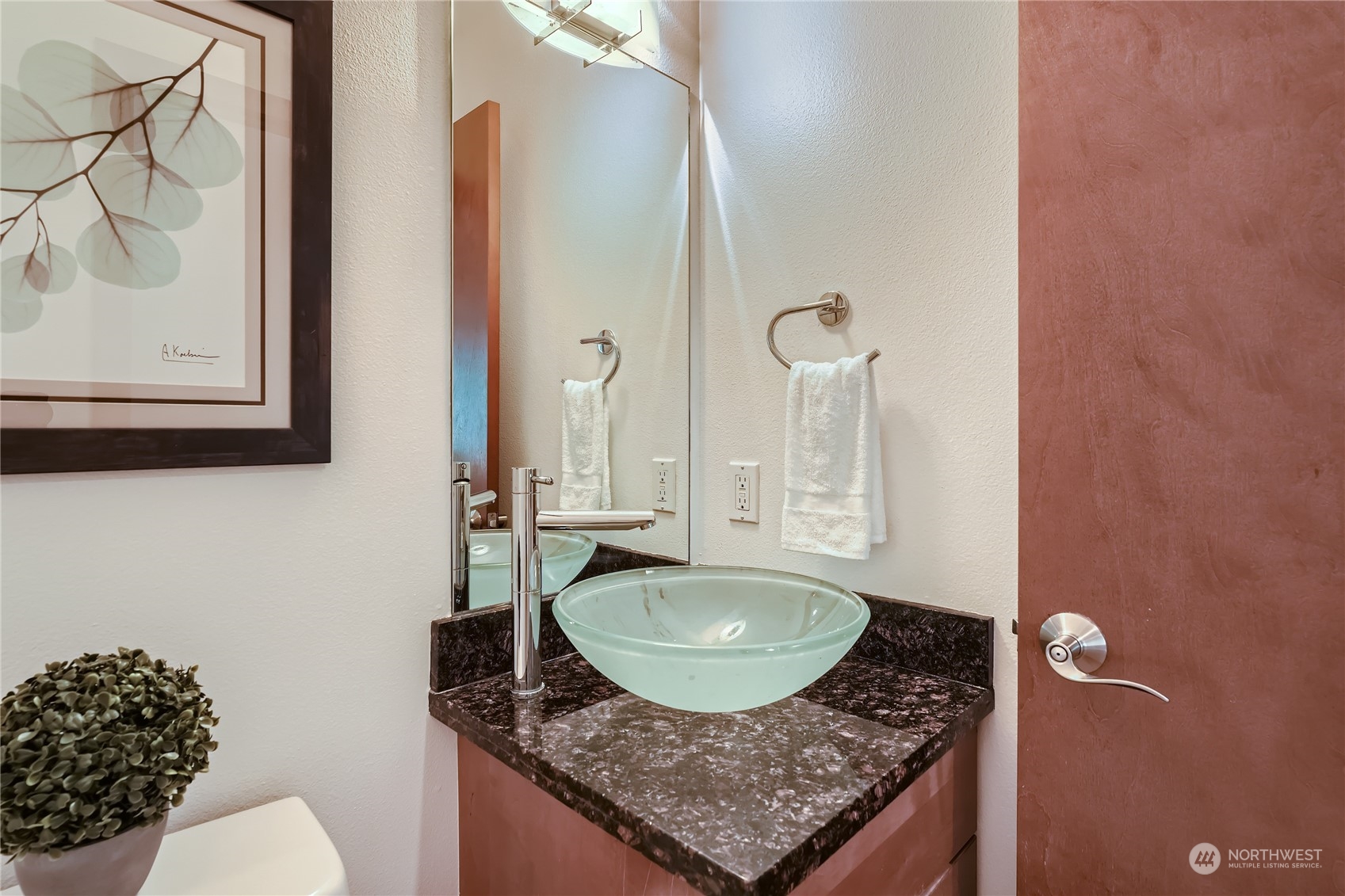 4313 South Webster Street, Unit B Seattle, WA 98118 - Photo 16 of 26 a bathroom with a granite countertop sink a toilet and a mirror