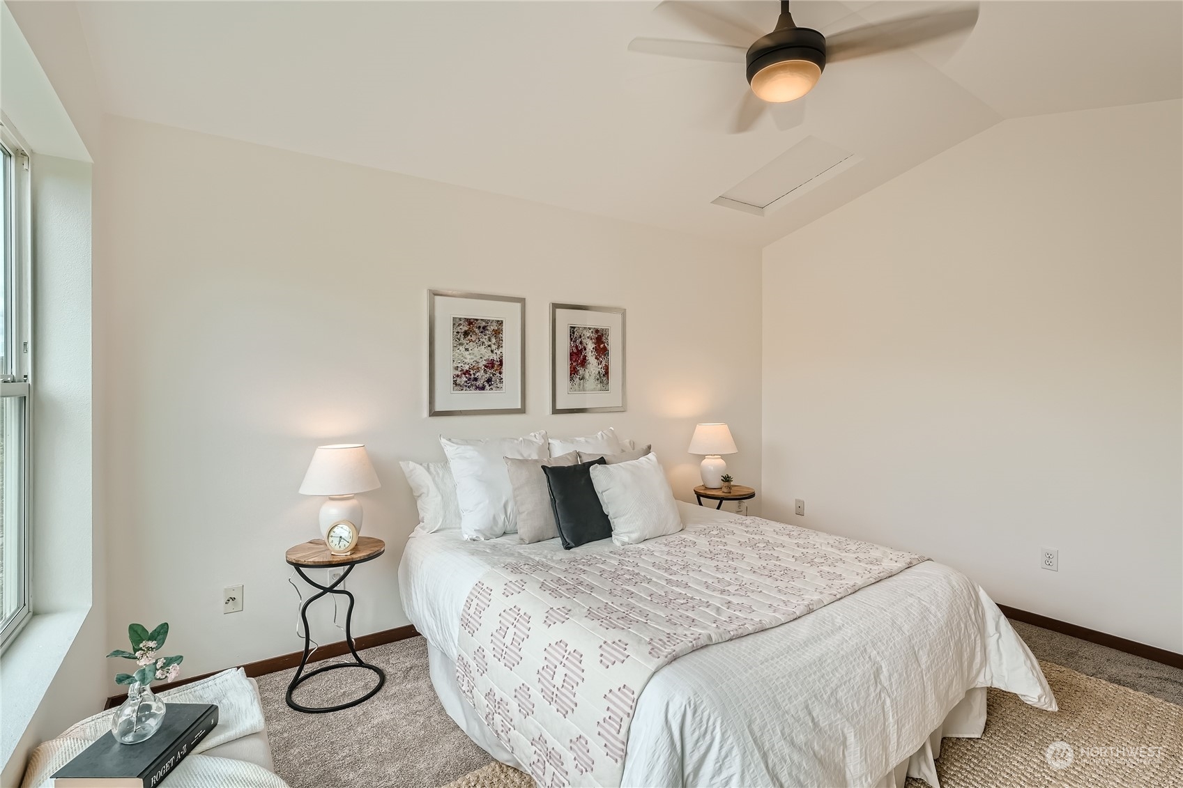 4313 South Webster Street, Unit B Seattle, WA 98118 - Photo 19 of 26 a bedroom with a bed and a table