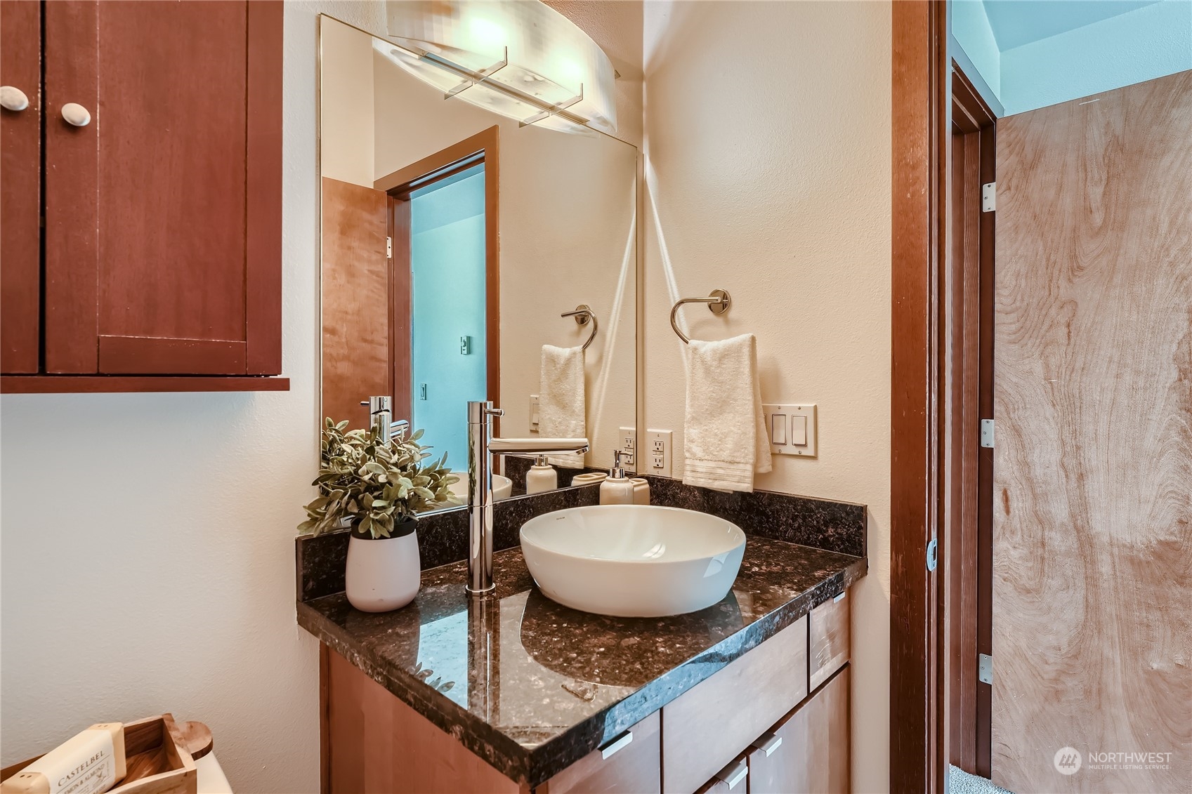 4313 South Webster Street, Unit B Seattle, WA 98118 - Photo 21 of 26 a bathroom with a granite countertop sink and a mirror