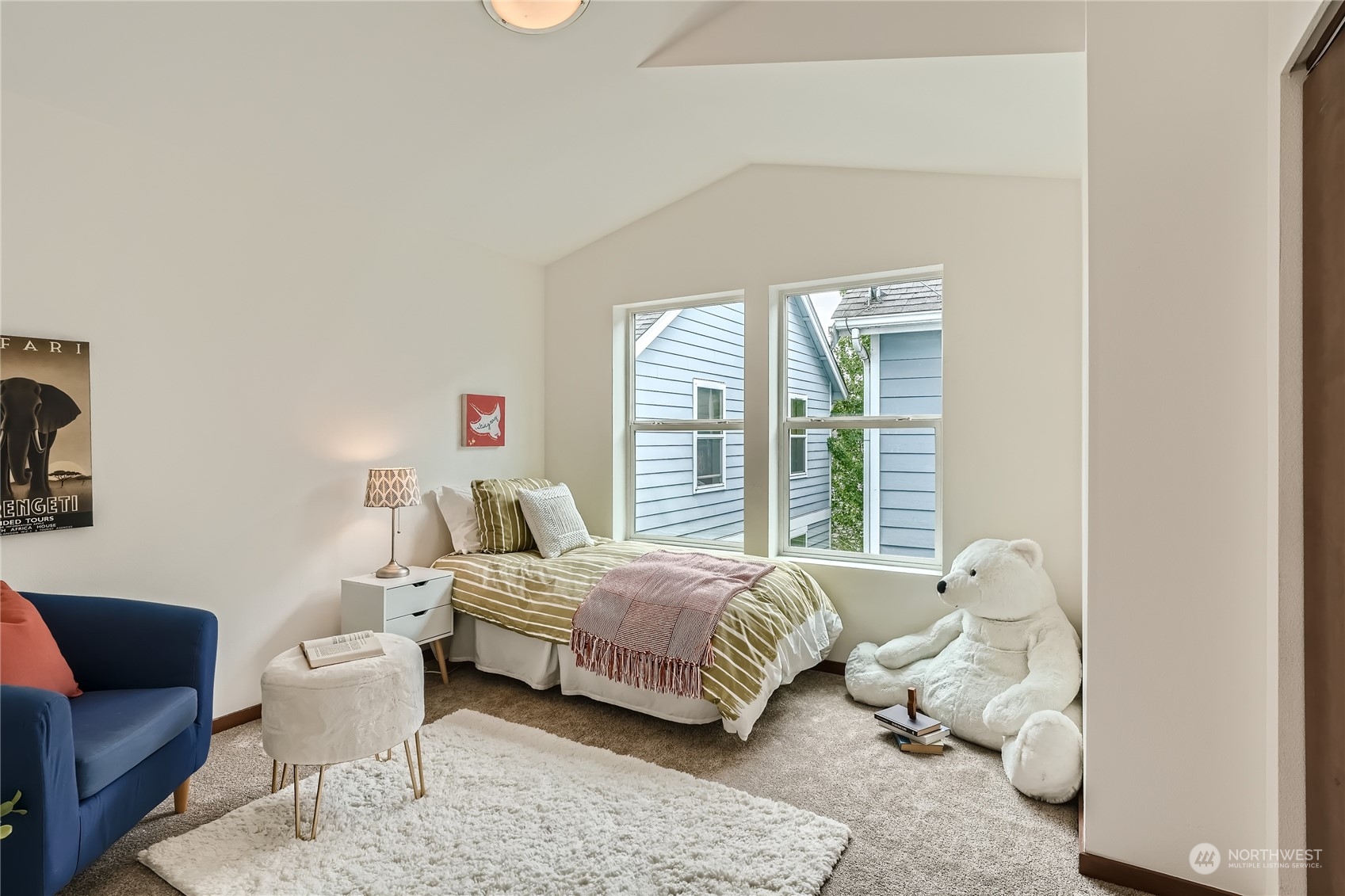 4313 South Webster Street, Unit B Seattle, WA 98118 - Photo 22 of 26 a bedroom with a bed and a couch