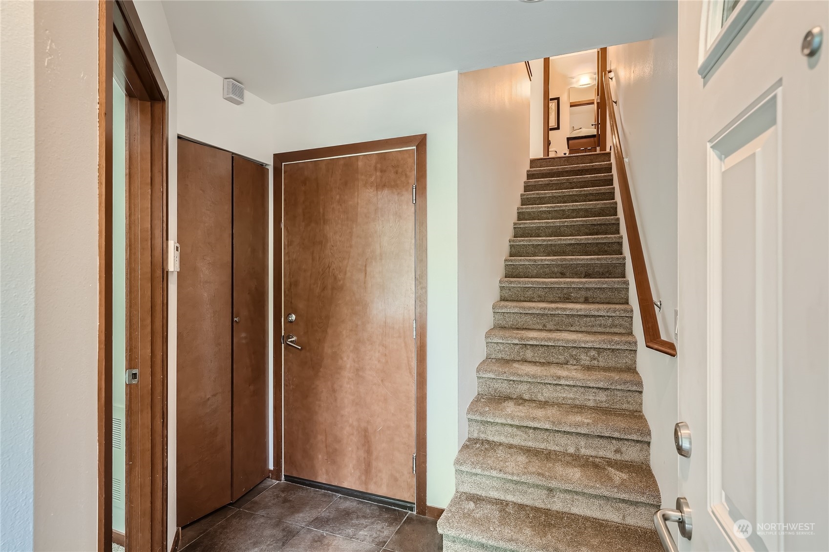 4313 South Webster Street, Unit B Seattle, WA 98118 - Photo 5 of 26 a view of an entryway with stairs