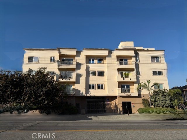 13525 Vanowen Street, Unit 102 Van Nuys, CA 91405 - Photo 1 of 13 a view of a building with a street
