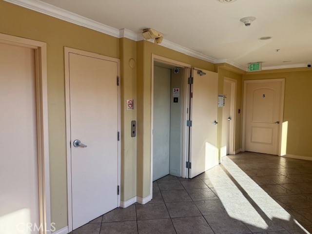13525 Vanowen Street, Unit 102 Van Nuys, CA 91405 - Photo 13 of 13 a view of a hallway with wooden floor