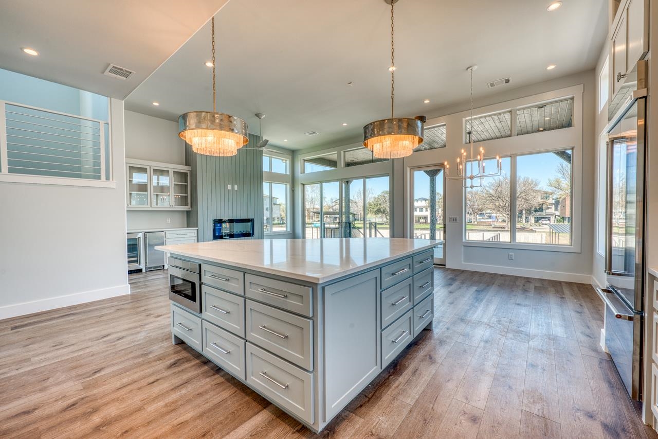 320 Lake Street Kingsland, TX 78639 - Photo 7 of 30 a kitchen with stainless steel appliances granite countertop a stove and a large window