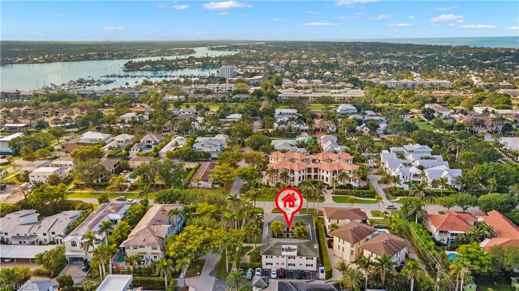 960 7th Street South, Unit 101 Naples, FL 34102 - Photo 11 of 11 an aerial view of residential houses with outdoor space