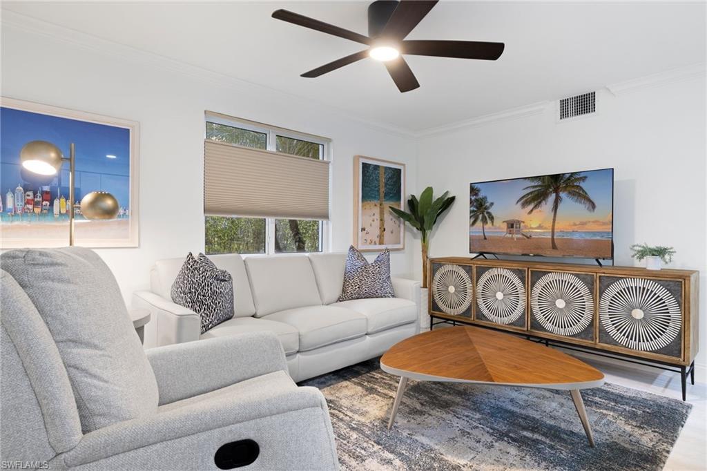 960 7th Street South, Unit 101 Naples, FL 34102 - Photo 3 of 11 a living room with furniture and a window