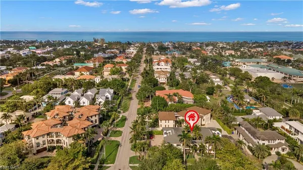 an aerial view of residential houses with outdoor space