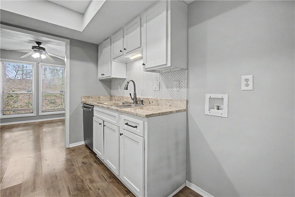 2011 Canyon Point Circle Roswell, GA 30076 - Photo 15 of 22 a utility room with cabinets washer and dryer