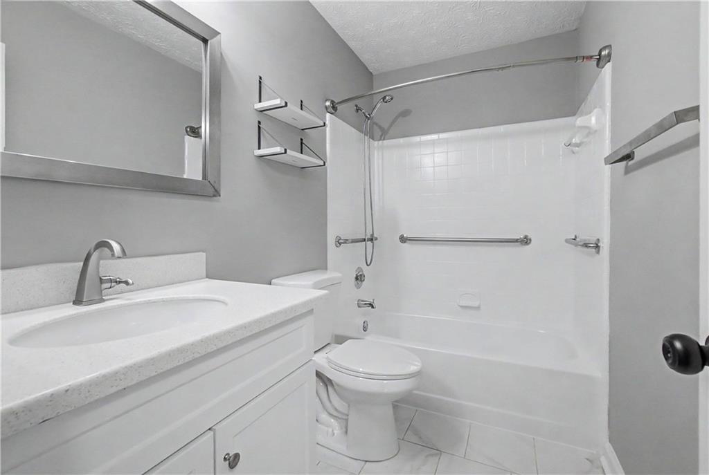 2011 Canyon Point Circle Roswell, GA 30076 - Photo 20 of 22 a bathroom with a sink toilet and shower
