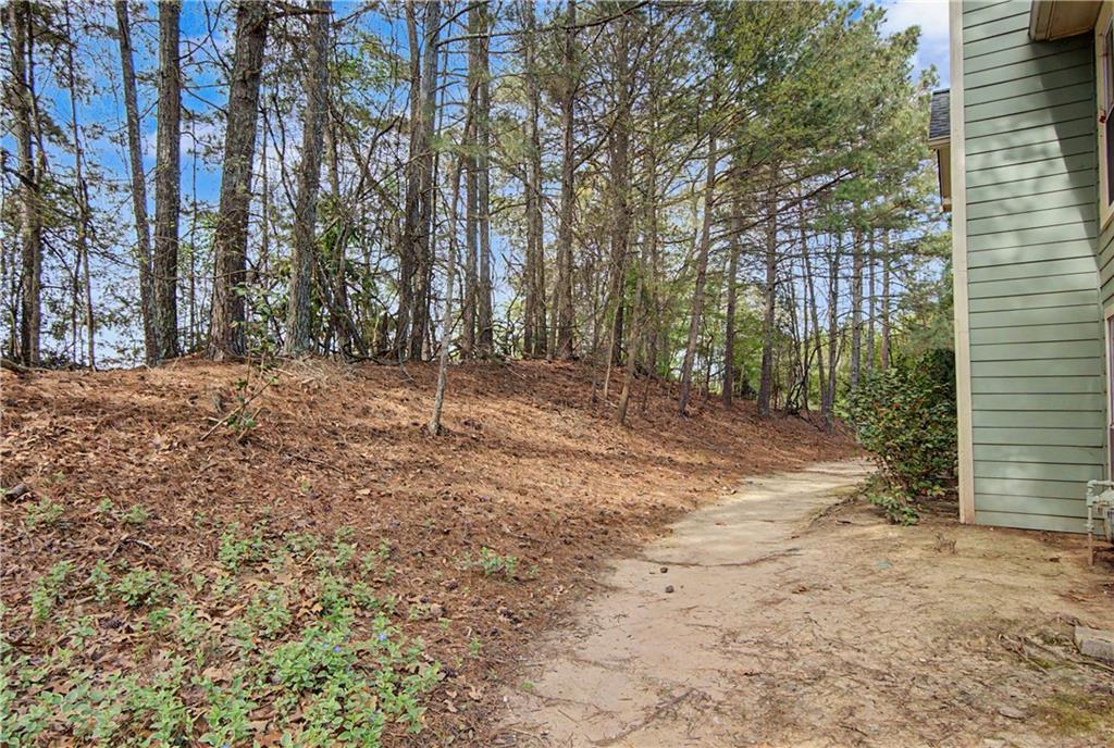 2011 Canyon Point Circle Roswell, GA 30076 - Photo 4 of 22 a view of a yard with trees