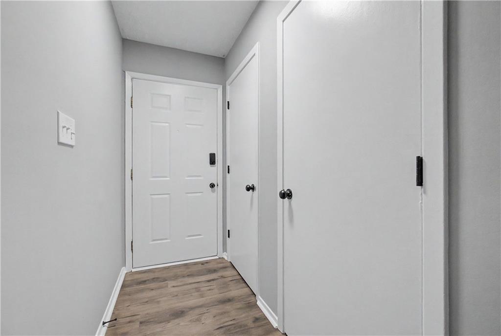 2011 Canyon Point Circle Roswell, GA 30076 - Photo 5 of 22 a view of a hallway with wooden floor