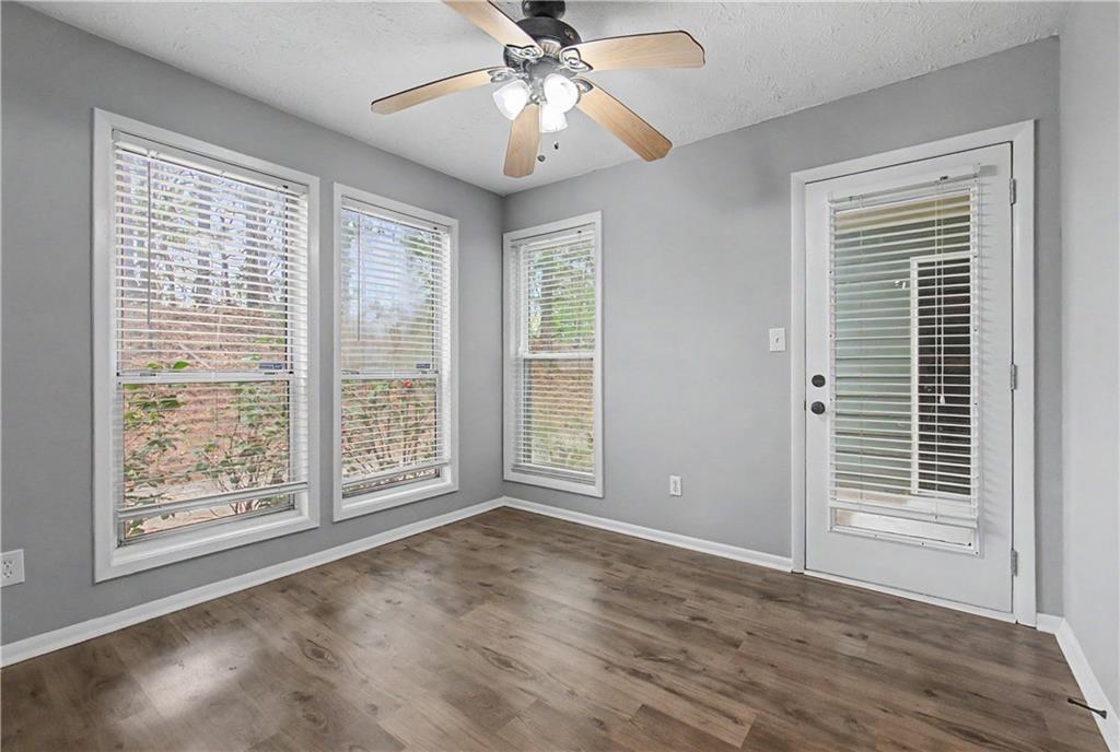 2011 Canyon Point Circle Roswell, GA 30076 - Photo 10 of 22 a view of an empty room with a window and wooden floor