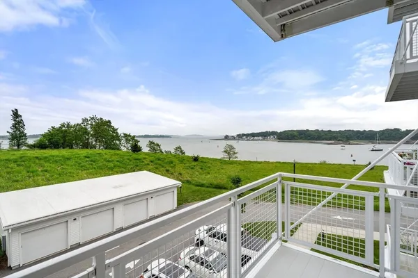 a view of a two chairs and table in the balcony