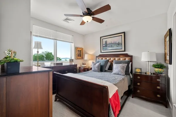 a bedroom with a bed and window