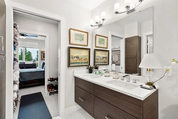 a bathroom with a sink double vanity and a mirror