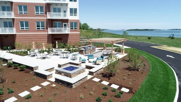 a terrace with outdoor seating and city view