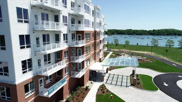 a front view of a building with lake view