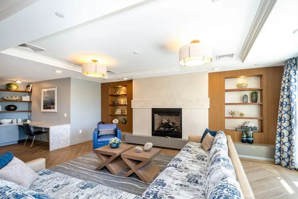 a large kitchen with a table and chairs