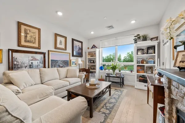 a living room with furniture and a large window