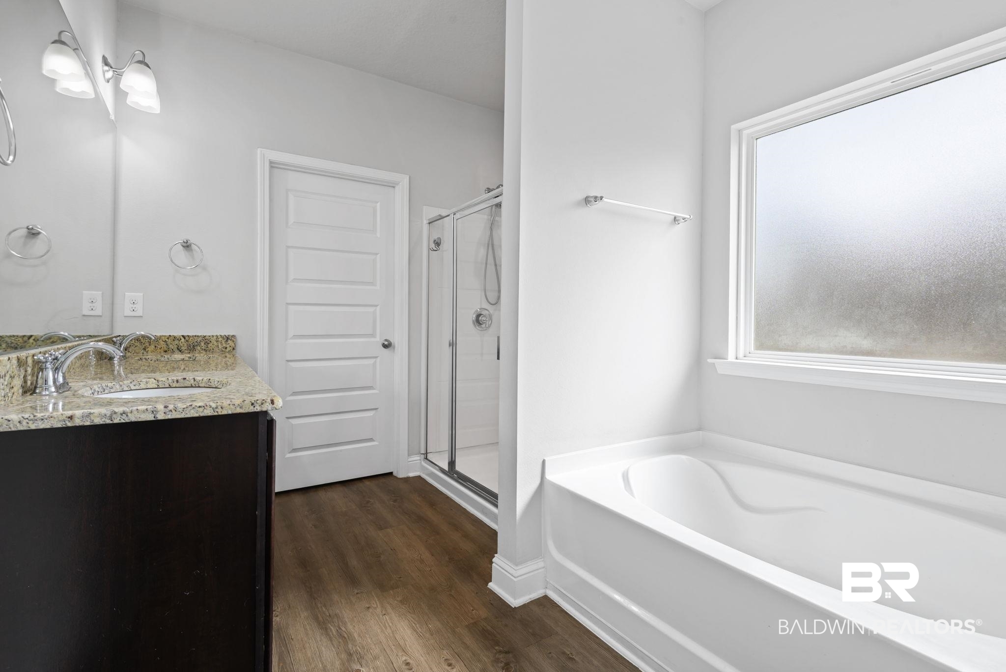 12693 Waxwing Avenue Daphne, AL 36527 - Photo 32 of 43 Bathroom featuring double vanity, a bath, a shower stall, and dark wood-style flooring