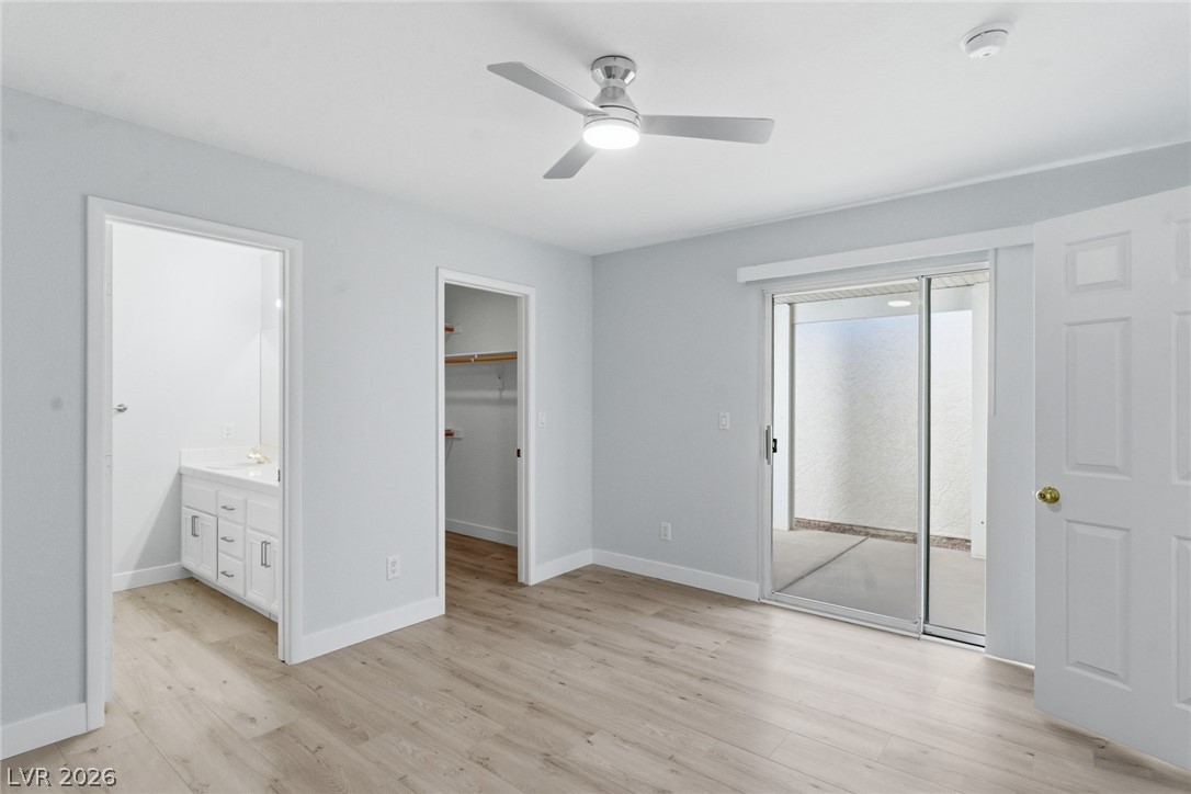 5449 Bugle Way, Unit 104 Las Vegas, NV 89108 - Photo 23 of 33 This bright room features durable flooring and convenient access to both a private patio and a vanity.