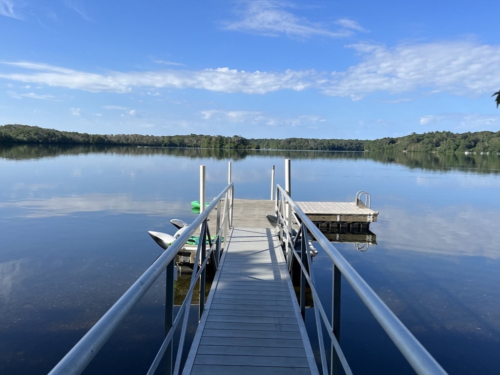 130 Pimlico Pond Road Mashpee, MA 02649 - Photo 1 of 39 a view of a lake with wooden floor and city view