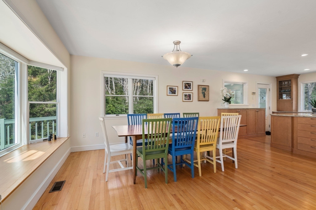 130 Pimlico Pond Road Mashpee, MA 02649 - Photo 12 of 39 a view of a dining room with furniture window and wooden floor
