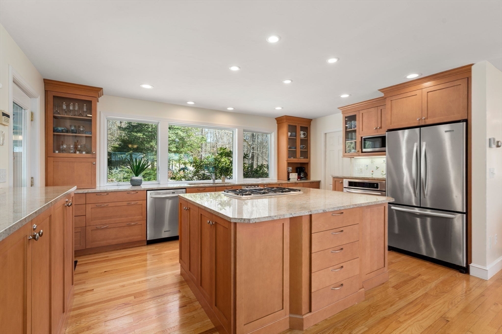 130 Pimlico Pond Road Mashpee, MA 02649 - Photo 13 of 39 a kitchen with kitchen island granite countertop a stove and a refrigerator