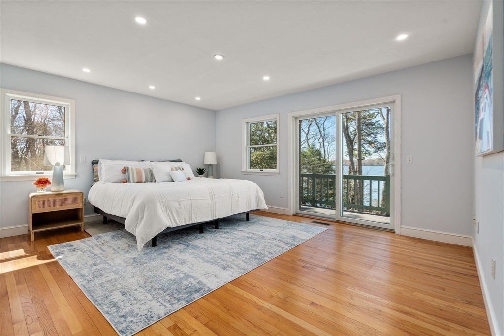 130 Pimlico Pond Road Mashpee, MA 02649 - Photo 15 of 39 a bedroom with a large bed and a large window