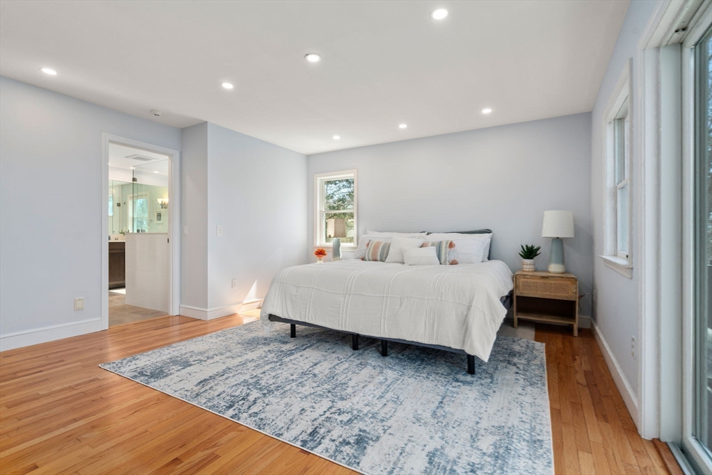 130 Pimlico Pond Road Mashpee, MA 02649 - Photo 16 of 39 a bedroom with a bed and wooden floor