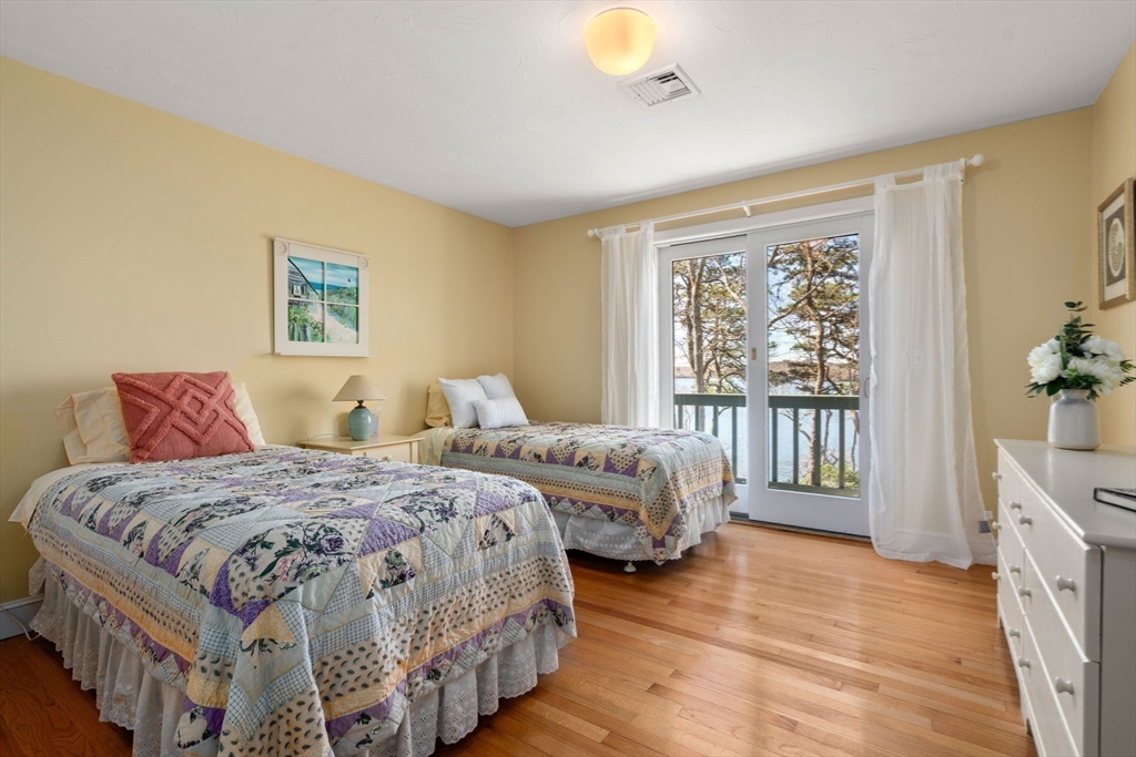 130 Pimlico Pond Road Mashpee, MA 02649 - Photo 21 of 39 a bedroom with two beds and a large window