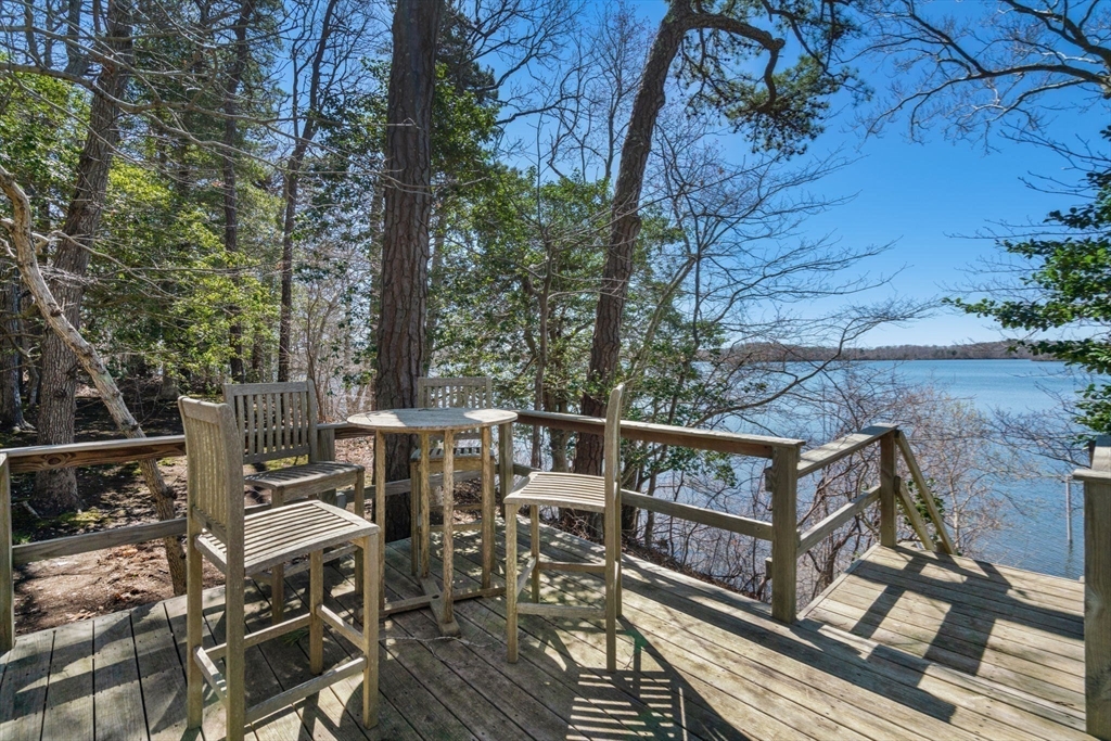 130 Pimlico Pond Road Mashpee, MA 02649 - Photo 31 of 39 a view of balcony with wooden floor and outdoor seating