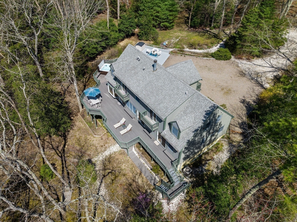 130 Pimlico Pond Road Mashpee, MA 02649 - Photo 34 of 39 an aerial view of a house with a yard and lake view