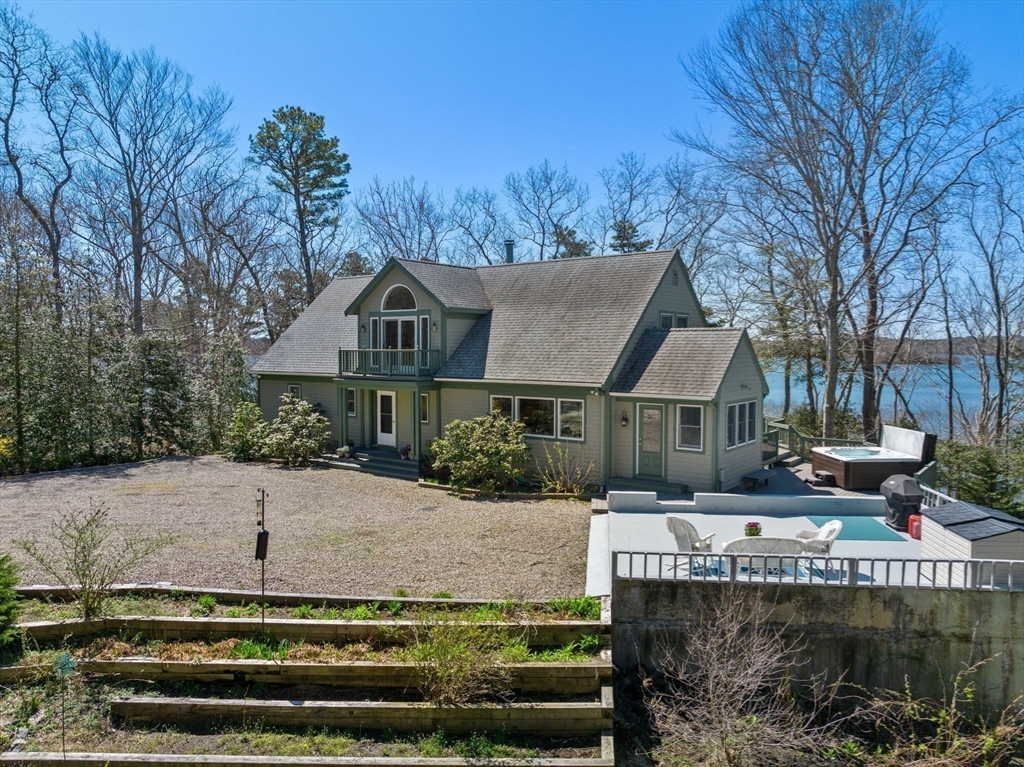 130 Pimlico Pond Road Mashpee, MA 02649 - Photo 37 of 39 a front view of a house with a garden