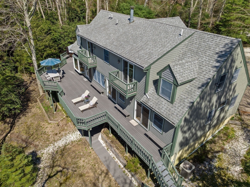 130 Pimlico Pond Road Mashpee, MA 02649 - Photo 6 of 39 aerial view of a house with a roof deck front of house
