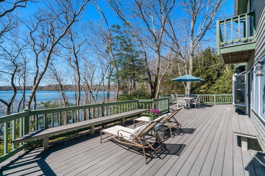 130 Pimlico Pond Road Mashpee, MA 02649 - Photo 7 of 39 a view of a roof deck with wooden floor and fence