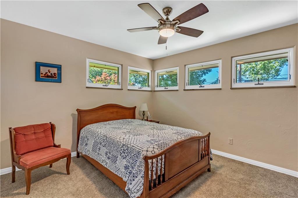 434 Summit Drive Pittsburgh, PA 15228 - Photo 13 of 24 a room with a bed and a chair