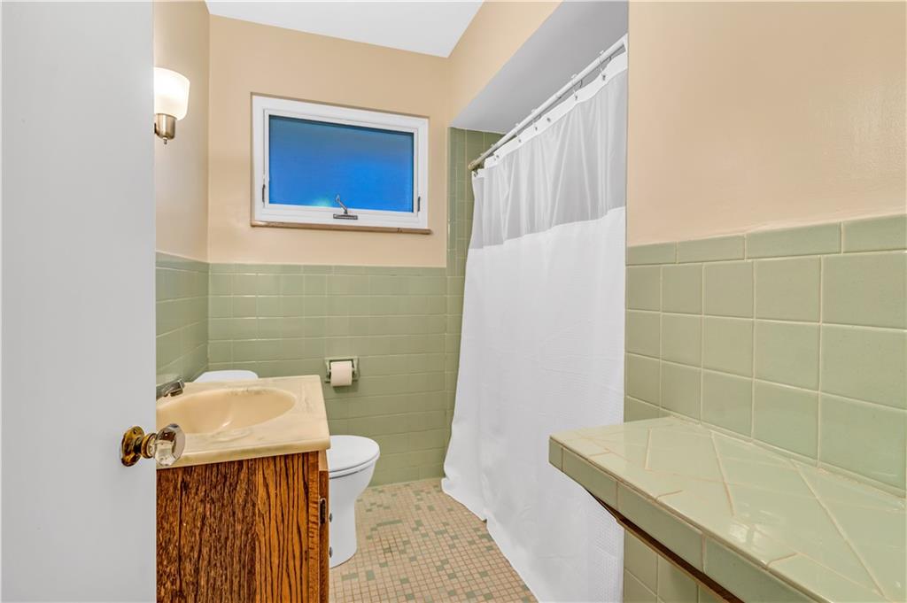 434 Summit Drive Pittsburgh, PA 15228 - Photo 16 of 24 a bathroom with a sink and toilet