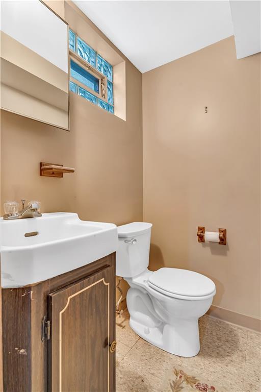 434 Summit Drive Pittsburgh, PA 15228 - Photo 19 of 24 a bathroom with a sink a toilet and a mirror