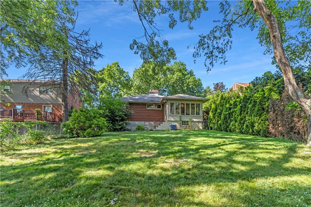 434 Summit Drive Pittsburgh, PA 15228 - Photo 22 of 24 a view of a house with a garden