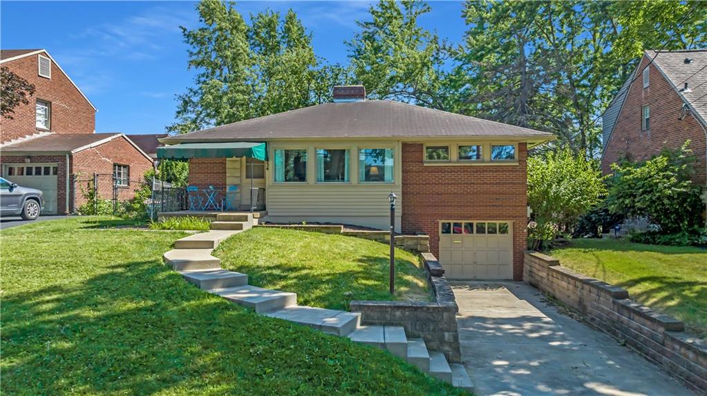 434 Summit Drive Pittsburgh, PA 15228 - Photo 24 of 24 a front view of a house with garden