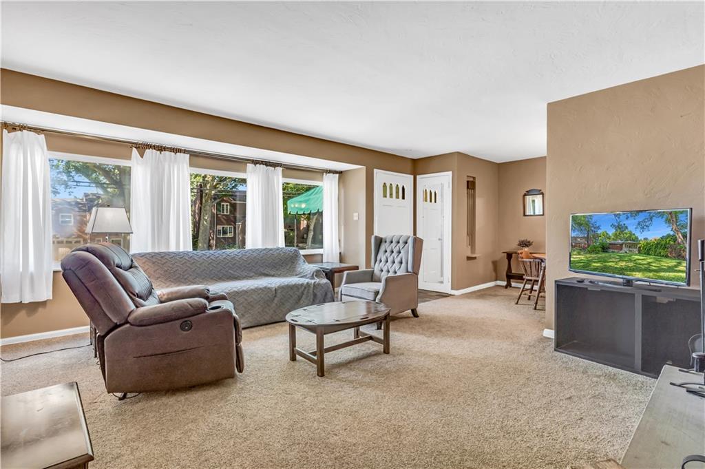 434 Summit Drive Pittsburgh, PA 15228 - Photo 3 of 24 a living room with furniture and a flat screen tv